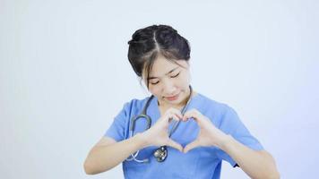 Asian female doctor delivers heart shape video