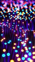 Multicolored LEDs moving in waves. Vertical looped video