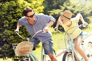 Happy couple riding bikes photo