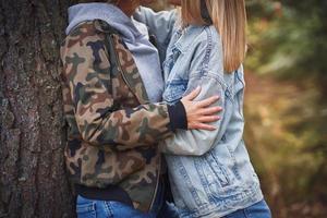 Two girl friends or lgnt couple in wood photo