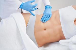 Picture of lipolysis treatment on different parts of woman body photo