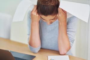 Young woman counting home budget with bills photo