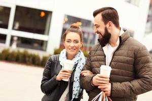 Young couple with shopping bags photo