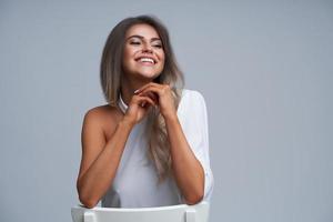 Beautiful adult woman portrait. Studio shot, isolated on gray background photo