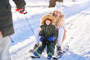 Nice happy family having fun on winter snow photo