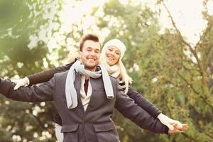 Happy couple having fun on a date in the park photo