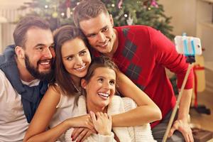 Group of friends taking selfie during Christmas photo