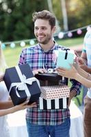 Group of friends having fun at birthday party photo