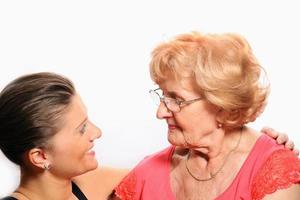 Grandmother and granddaughter talking photo