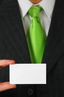 Business man holding business card photo