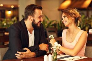 Romantic couple dating in restaurant photo