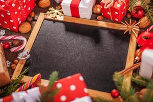 Merry Christmas holiday background - black chalkboard in wooden frame photo