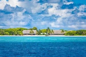 Amazing Maldives scenery, luxury resort water villas and tropical sea. Perfect exotic landscape and travel destination. Maldives beach tourism template photo