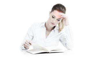 Businesswoman with documents having headache photo