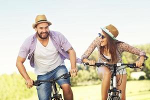 Romantic couple riding bikes photo