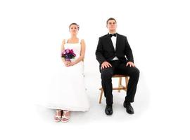 Married couple sitting over white background photo