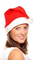 Beautiful girl in Santa's hat photo