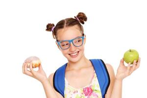 Schoolgirl with two lunch choices photo
