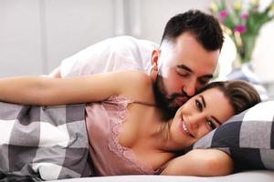 Adult attractive couple in bed photo