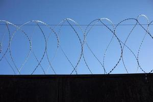 Barbed wire fence. Details of industrial area. photo