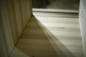 Boards on table. Furniture details. Blanks made of wood. photo