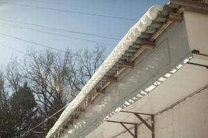 Roof of house. Canopy of house. Architecture details. photo