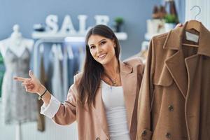 Young nice girl in store during shopping photo