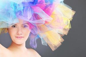 Woman in a rainbow hat photo