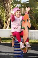 Baby girl in the playground photo