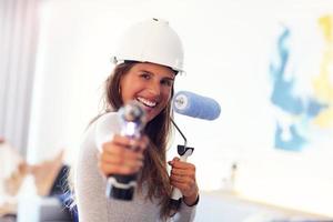 Mature woman doing home improvements photo