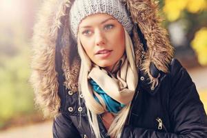 Portrait of a woman in the park in autumn photo