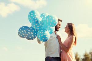 Romantic couple with baloons photo