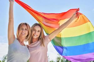 Woman wearing lgbt flag outdoor. photo