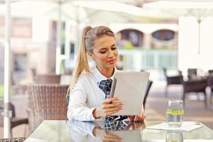 Young manager working in cafe photo