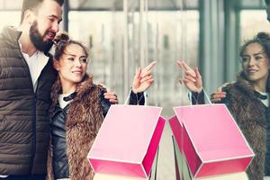 Young couple in shopping center photo