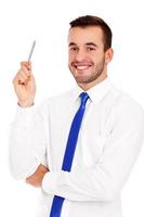 Successful businessman posing with a pen photo