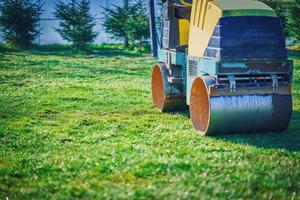 Picture of a road roller machine on the different surfaces photo