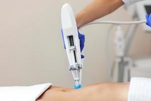 Woman having abdomen mesotherapy in beauty salon photo