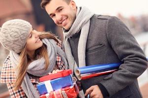 Beautiful couple on Christmas shopping photo