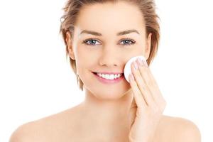 Woman cleaning face photo