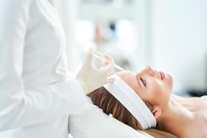 A scene of medical cosmetology treatments botox injection. photo