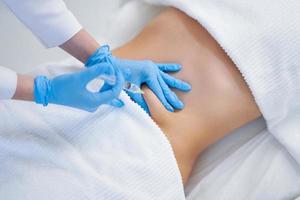 Picture of lipolysis treatment on different parts of woman body photo