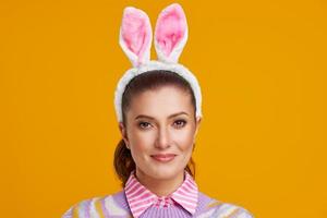 Studio shots of woman over yellow background easter style photo