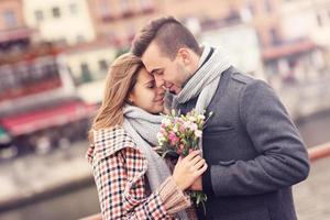 Romantic couple with flowers on a date photo