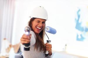 Mature woman doing home improvements photo