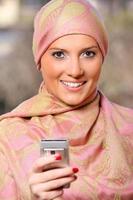 Arabic businesswoman with a cell phone photo