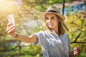 Woman with phone in the park. photo