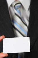 Business man holding business card photo