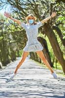 Woman jump in the park. photo