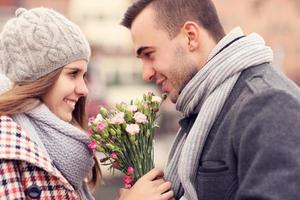 Romantic couple on a date with flowers photo